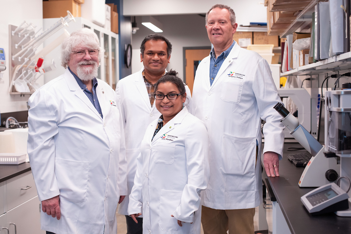 Iowa State researchers, left to right, Michael Wannemuehler, Saji Uthaman, Rizia Bardhan and Gregory Phillips in a lab in the Advanced Teaching and Research Building.